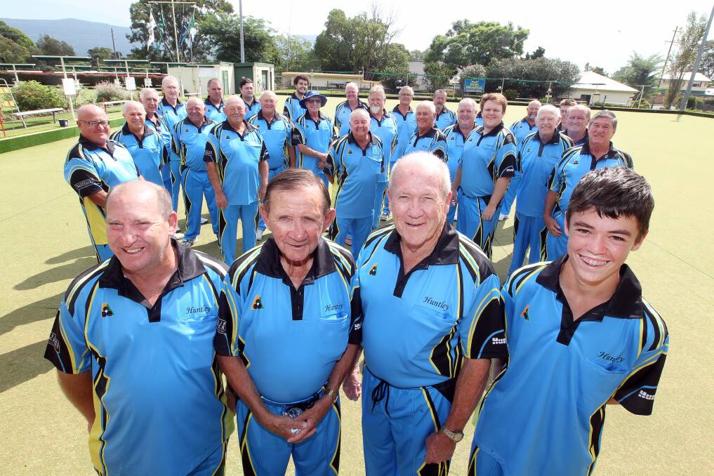In style: Dapto members (front, left to right) Kevin Draper, Dasha Horne, Frank Coakes and Perry Avnell with other bowlers show off their new uniform. Picture: SYLVIA LIBER