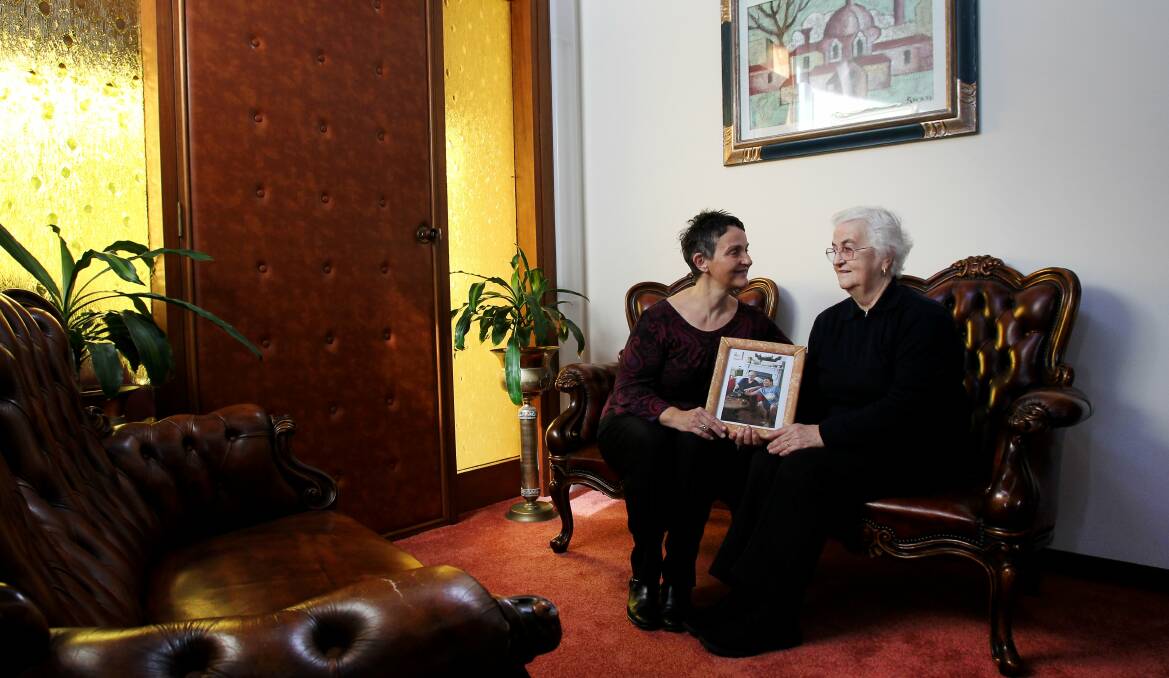 Peace of mind: Rosanna Wallis with her mother, Marina Comacchio, and a photograph of Mr Comacchio. Picture: KIRK GILMOUR