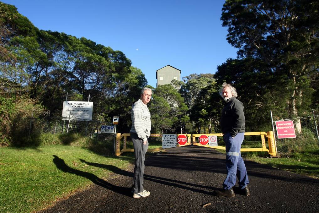Steve Drain and Joe Kirkwood outside the closed gates of the Wongawilli Mine. Pictures: SYLVIA LIBER
