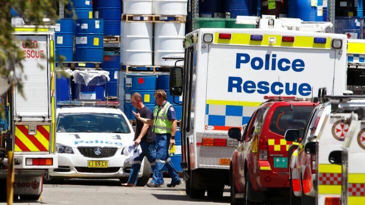 Paramedics are seen on the scene where three men were trapped in a tank in Auburn on December 7, 2017 in Sydney, Australia. (Photo by Daniel Munoz/Fairfax Media)
