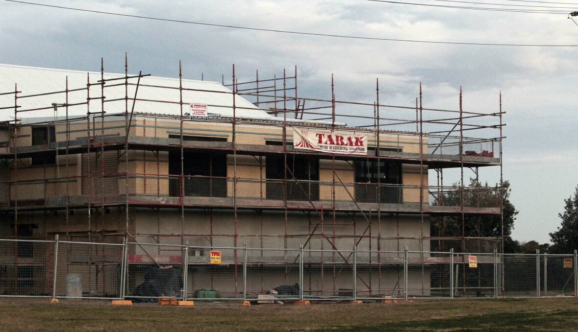 All built up: The Tabak sign graces the Corrimal surf lifesaving club, which is being renovated. Picture: ANDY ZAKELI

