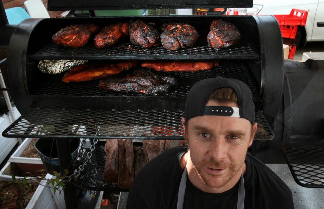 Andy Burns with one of one of his smokers. Burnsbury's fare of smoked ribs and wings is attracting plenty of Illawarra fans. Picture: KIRK GILMOUR