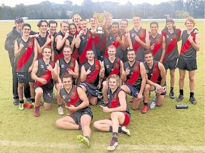 Champs: The Edmund Rice side celebrates winning the Swans Cup at Blacktown International Sports Park.