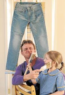 For charity: Paul Dorin and daughter Ciara Dorin. Paul is painting jeans from Hollywood star Jonah Hill.Picture: ADAM McLEAN