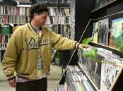 Soundmerch record store owner Tim Everist says vinyl provides the ultimate listening experience. (James Ross/AAP PHOTOS)