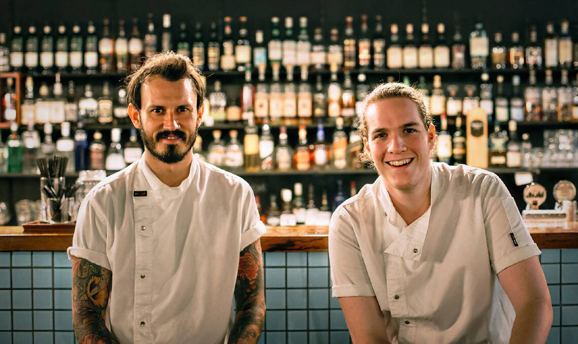 Hungry Wolf chefs Johnny Thompson and Angus McCarthy at work in the newly opened Wollongong restaurant.