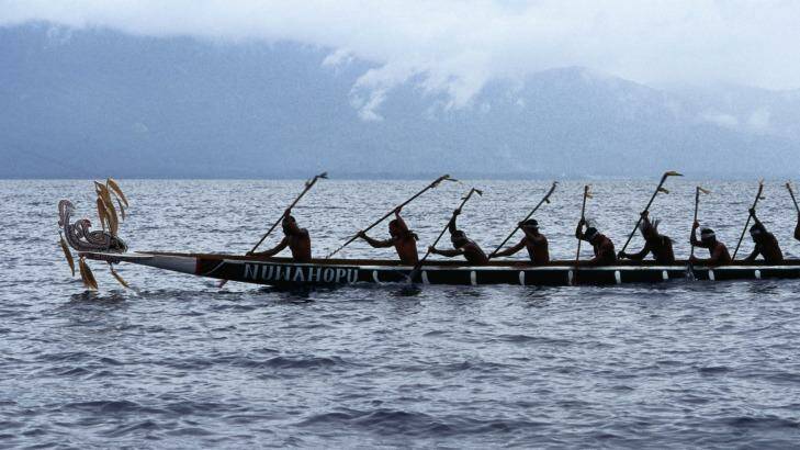 A war canoe takes part in the annual festival in Alotau. Photo: Getty Images 