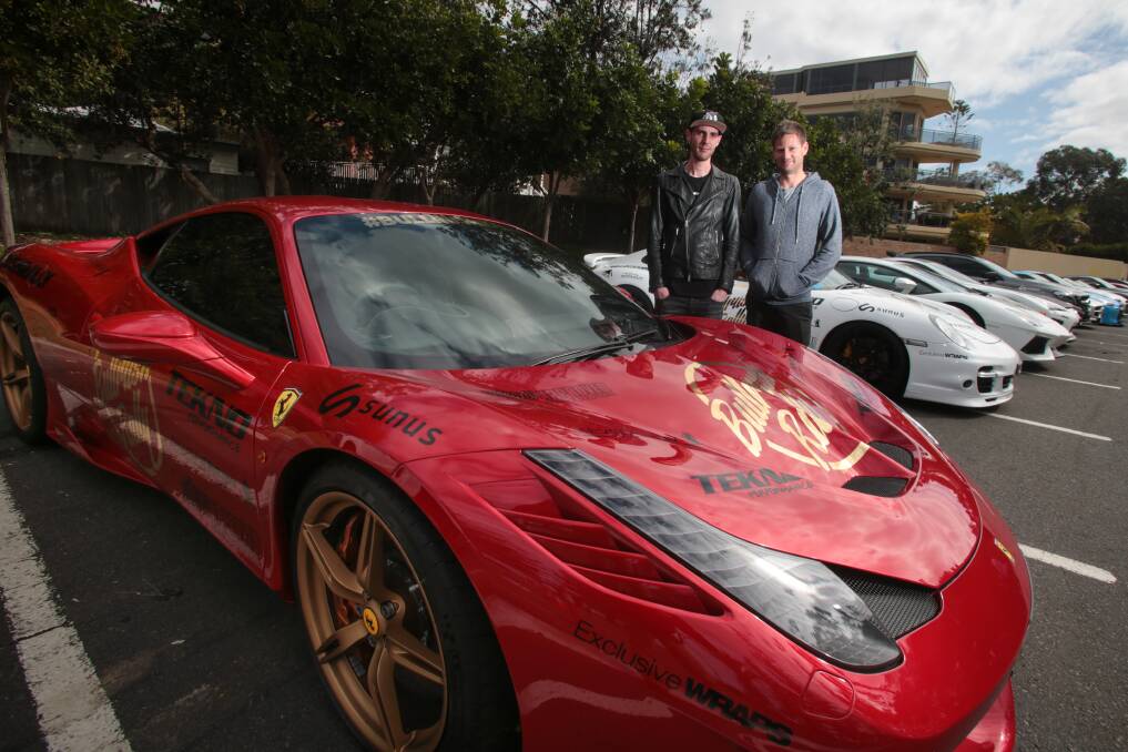Bullrush Rally co-founders Cameron Hystek and Marko Seider with a Ferrari 458 Speciale near North Wollongong Beach. Picture: ADAM McLEAN