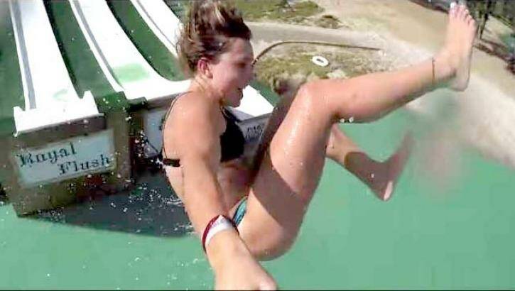 Thrill-seekers engage in all manner of acrobatics in the Royal Flush water slide video.