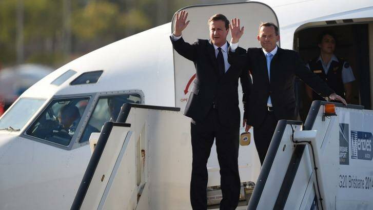 British Prime Minister David Cameron and Australian counterpart Tony Abbott arrive in Brisbane. Photo: Peter Parks