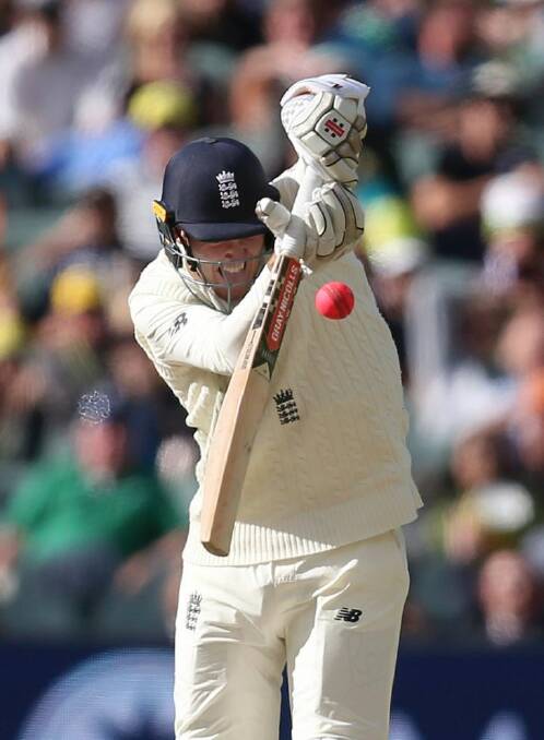 England's Craig Overton plays at a high ball against Australia during the third day of their Ashes cricket test match in Adelaide, Monday, Dec. 4, 2017. (AP Photo/Rick Rycroft)