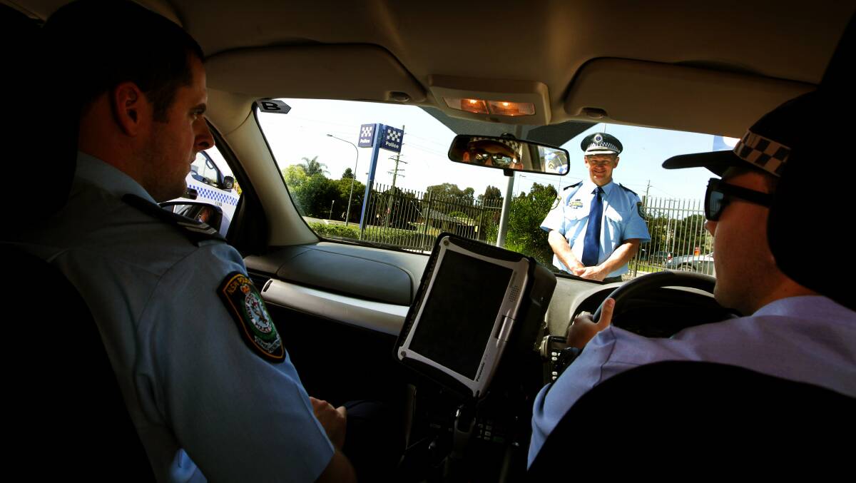 Superintendent Wayne Starling with Senior Constable Ryan Simpson and Constable Steven Uglow in the car ready for an open day with the public at Oak Flats police station. Picture: SYLVIA LIBER