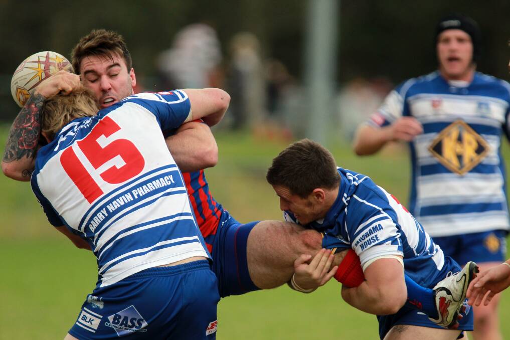 Wests’ Zac Hill loses possession in a spirited two-on-one  tackle. Picture: SYLVIA LIBER