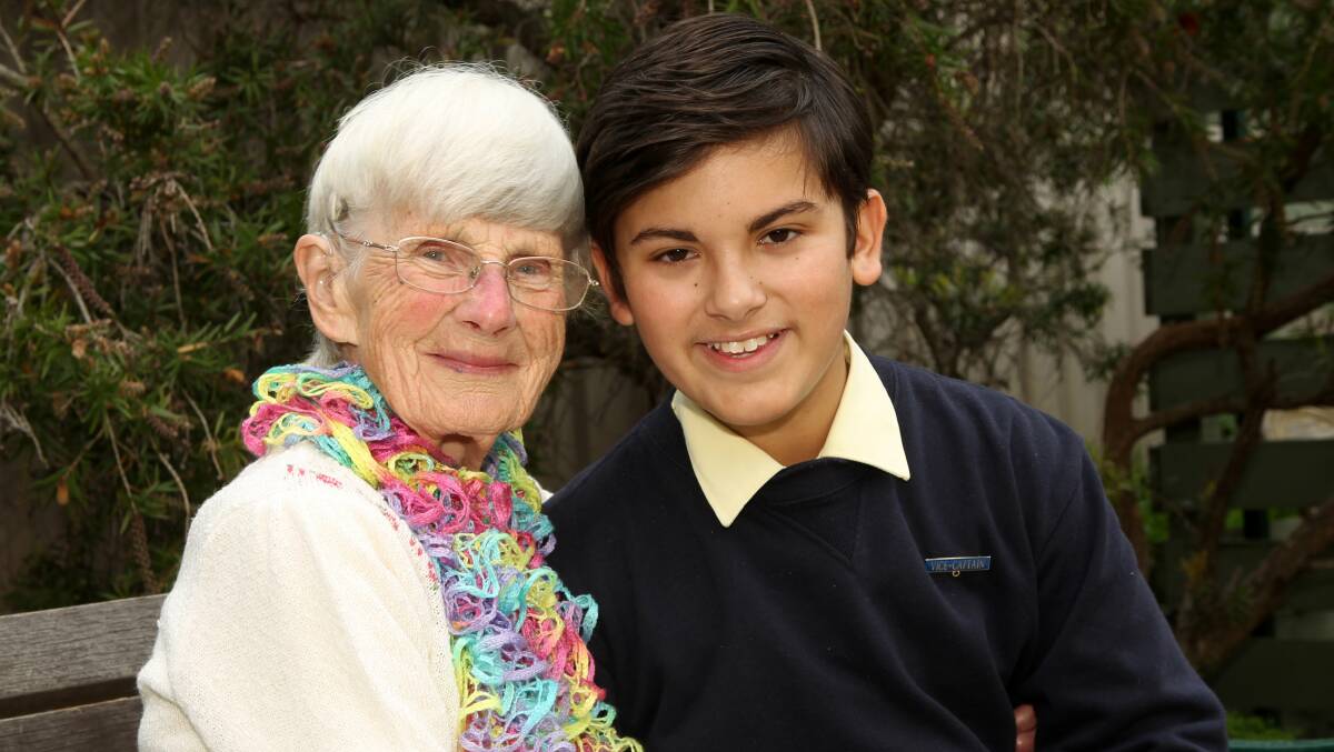 Dorothy Keswick, 89, from the Multicultural Aged Care Village, Warrawong, and St Francis of Assisi Catholic Primary School student Jack Clare, 12. Picture: GREG TOTMAN
