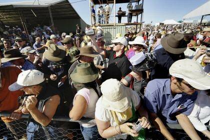 The tiny outback town of Birdsville swells to thousands during the annual races.  