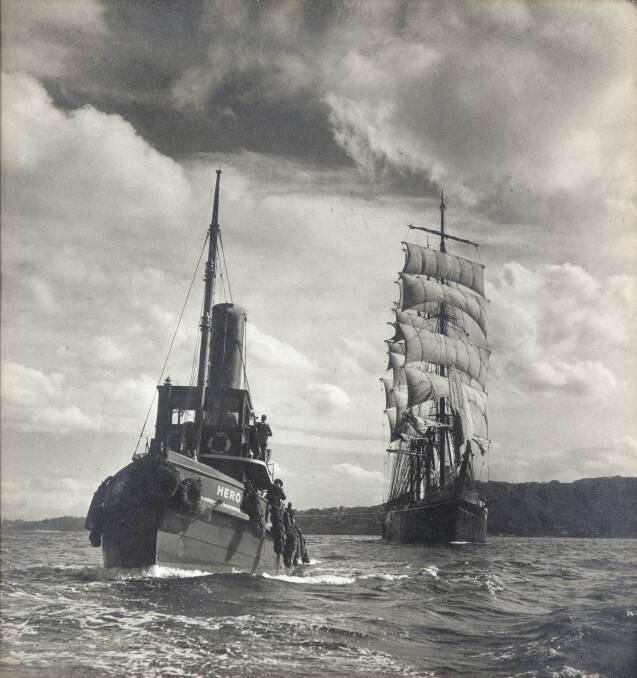 The tugboat Hero tows the Pamir to sea from Sydney Harbour in 1947. Picture: MAX DUPAIN, Australian National Maritime Museum