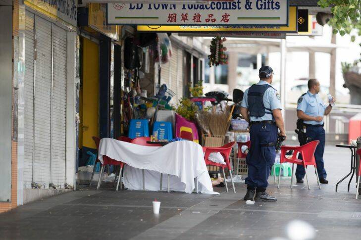 Police work a crime zone after a reported shooting in Bankstown CBD in front of a cafe, 23 January 2018. Photo by Cole Bennetts