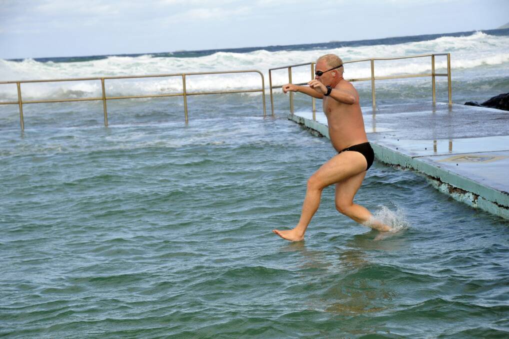 Therapeutic: Towradgi ocean pool regular Gary Power goes for a swim on Thursday.