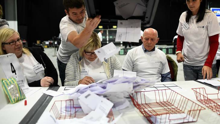 Workers prepare to count ballots at a counting centre in Aberdeen, Scotland. Photo: Reuters