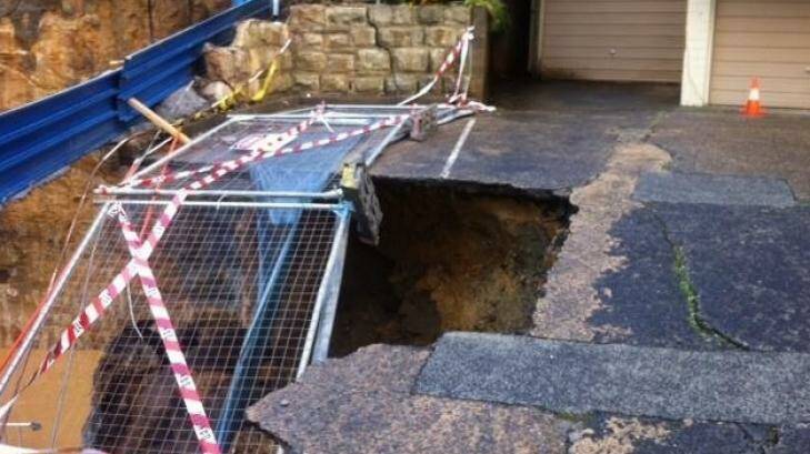 Part of the driveway of a unit block collapsed. Photo: NSW Fire & Rescue