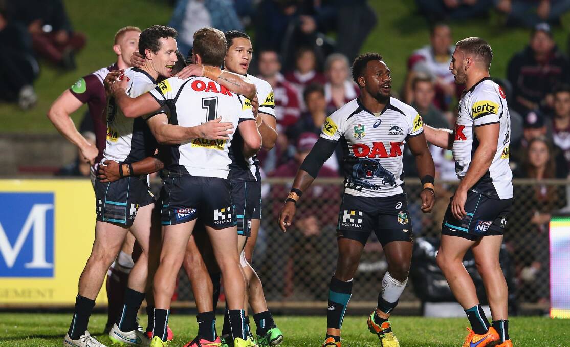 David Simmons of the Panthers celebrates with his teammates after scoring a try during the NRL match against Manly at Brookvale Oval on Monday night. Picture: GETTY IMAGES