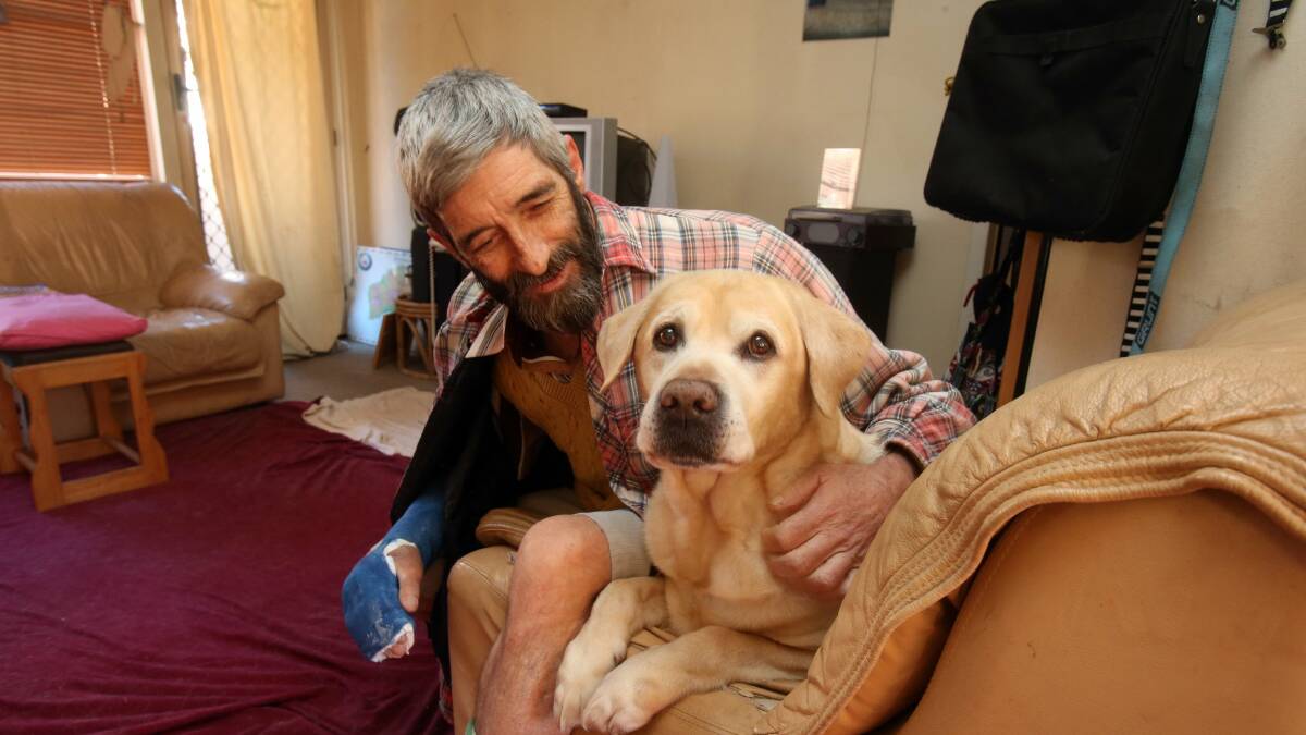 Garry, with his companion, Obi, says life is a constant struggle without a home. Picture: ROBERT PEET