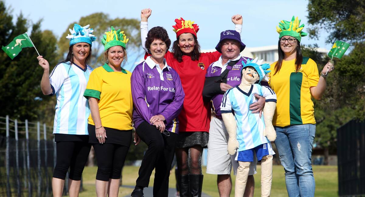 Maree Friend, Sharon McFarlane, Heather Friend, Danielle Attorre, John Friend (and mascot) and Angela Brakenridge get ready for the Illawarra Relay for Life, which this year celebrates major international sporting events such as the soccer World Cup. Picture: KIRK GILMOUR