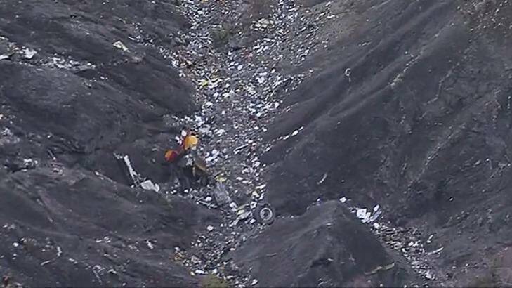 Debris scattered over the crash site near Seyne-les-Alpes in the French Alps on Tuesday. Photo: TF1/AP