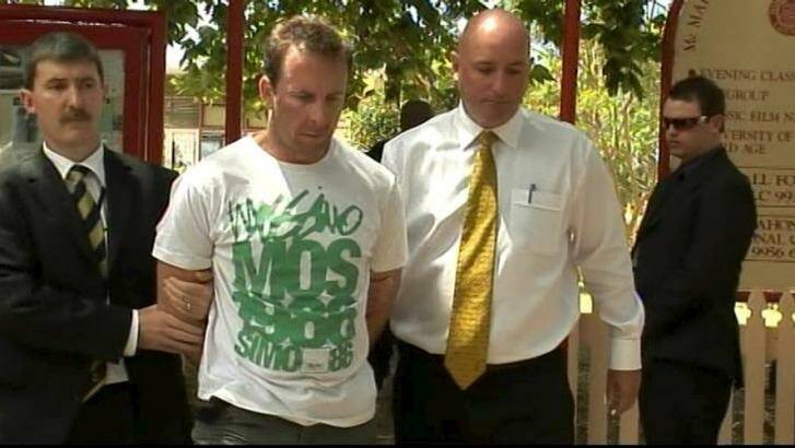 Sean Waygood is led away after his dramatic arrest at a cafe on Sydney's north shore in January 2009. Photo: Police Media