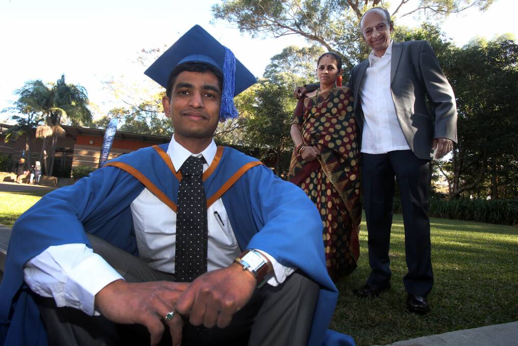 Proud: Sanjeev Murthy, who graduated on Wednesday with a masters in engineering management, with parents BKA and Uma. Picture: ROBERT PEET