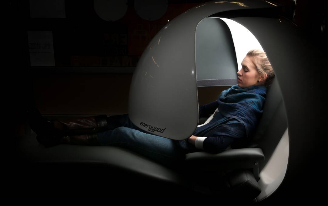 Resting: Wellbeing programs officer Meredith Young-Whitford tries out the energypod chair. Picture: ADAM McLEAN