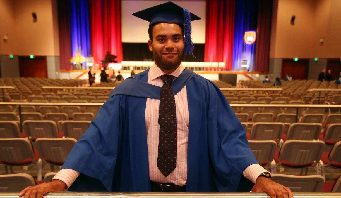 Part of family life: Jared Wolfers, 22, from Austinmer graduated with a Bachelor of Commerce from UOW on Wednesday. Picture: ROBERT PEET