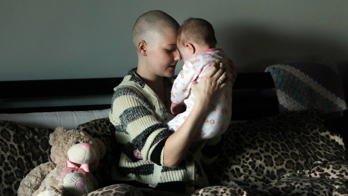 Cancer-stricken: Eighteen-year-old Emma Drummond relies on her parents to look after Casey-Lee while she undergoes treatment for bone cancer.Picture: SYLVIA LIBER