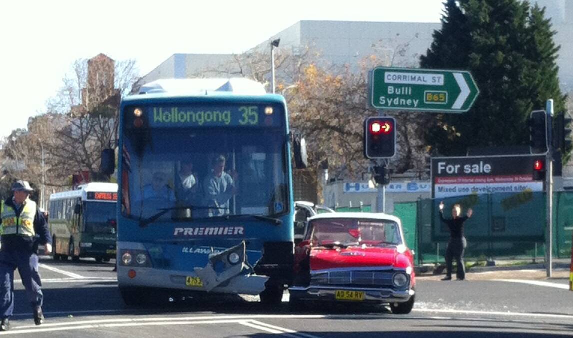 The car and bus on the corner of Burelli and Corrimal streets. Picture: DJ DAVI GEE