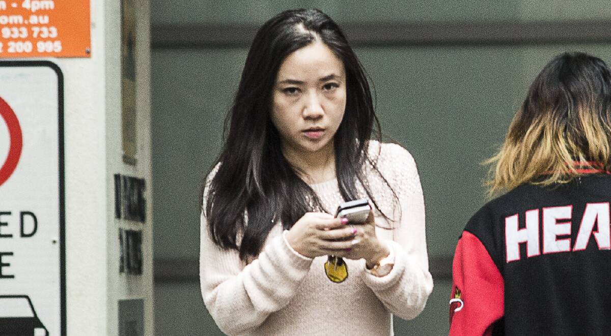 Yingying Dou, who is the director of the MyMaster website, walks out the back entrance of Yingcredible Tutoring when the Herald spoke to her on November 10. Picture: DOMINIC LORRIMER