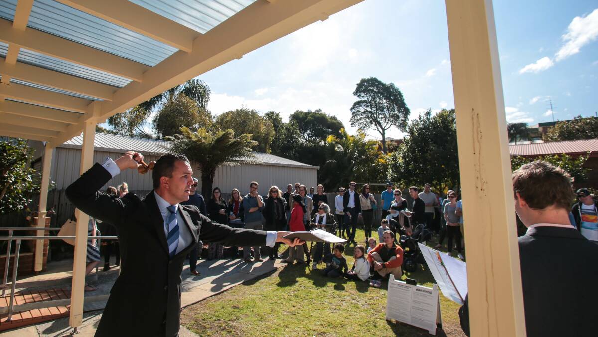 McGrath Estate Agents auctioneer Clarence White in action during the Saturday auction of 32 Beacon Avenue Bulli. Picture: ADAM McLEAN
