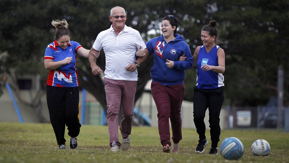 Father-of-five Bob Jones, pictured with his wife Catherine and daughters Alley and Grace, has been nominated for the Philips Community Sports Dad of the Year award for his tireless volunteer work. 