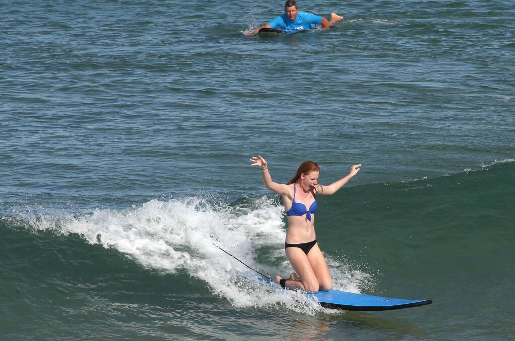 Ellie Williams from Figtree learns to surf at Towradgi Beach. Picture: KIRK GILMOUR