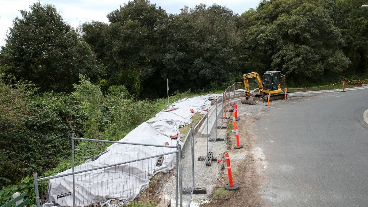 Material is covered at a Wollongong City Council work site on Sea Foam Avenue, Thirroul. The mounds containing asbestos are to be sealed off. Picture: KIRK GILMOUR