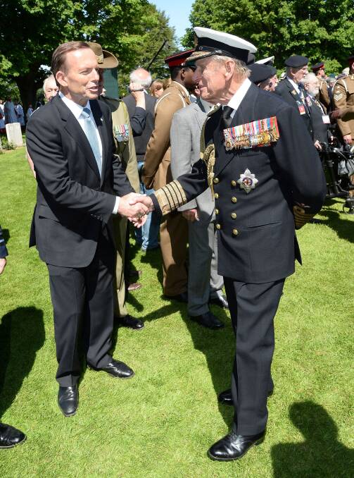 Prime Minister Tony Abbott and Prince Philip at a Service of Remembrance at Bayeux Cathedral. Picture: SAMIR HUSSEIN
