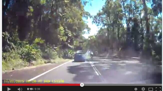 Cyclist weaves through Bulli Pass traffic: video