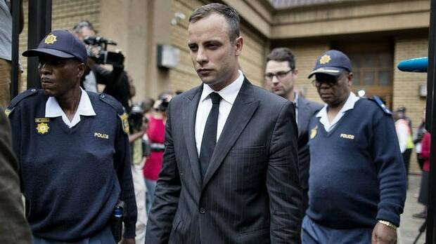 Oscar Pistorius (centre) leaves the North Gauteng High Court in Pretoria. The court has adjourned until May 5. Picture: AFP
