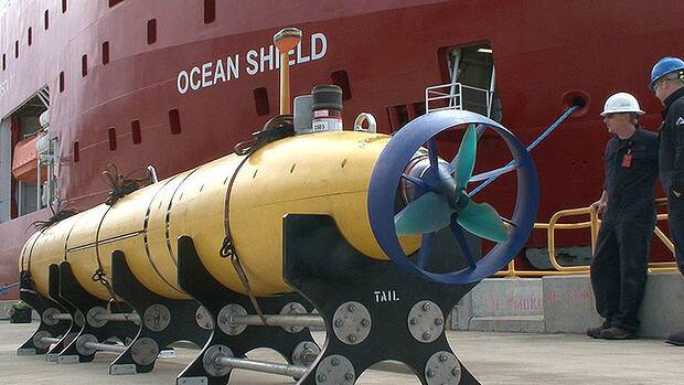 The Bluefin-21 autonomous underwater vehicle is prepared for loading on to the Ocean Shield. Picture: AMANDA HOH