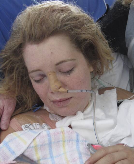 Jacqueline Sparks cradles her baby Mia, who did not survive the crash.