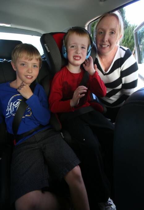 Emma Noonan, from Barrack Heights, with her twin boys Joshua and Domonic, 8. Picture: ROBERT PEET