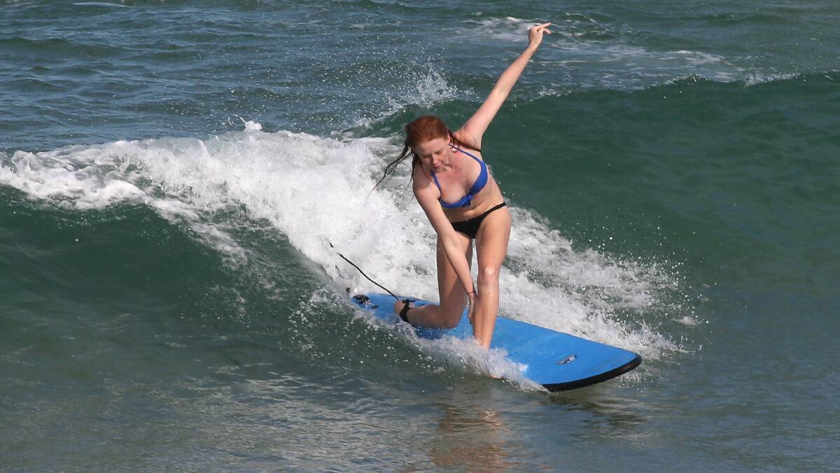 Ellie Williams from Figtree learns to surf at Towradgi Beach. Picture: KIRK GILMOUR