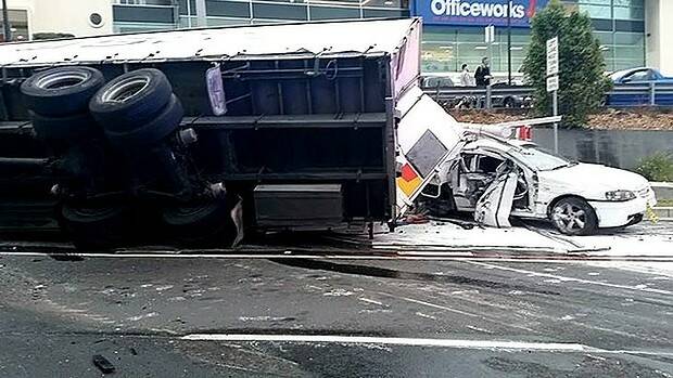 Accident: A truck overturned at the intersection of Warringah Road and Pittwater Road. Photo: Kevin Lynch

