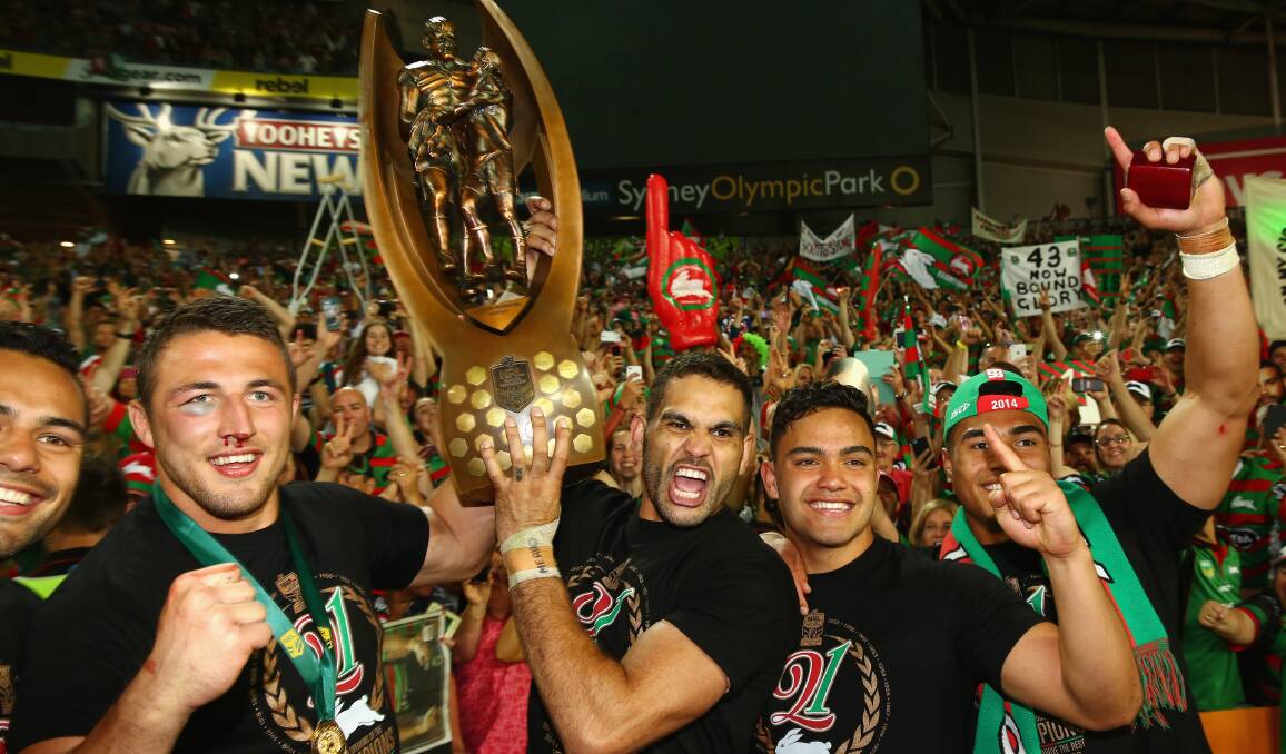 Sam Burgess, Greg Inglis and Dylan Walker with the trophy. Picture: GETT IMAGES
