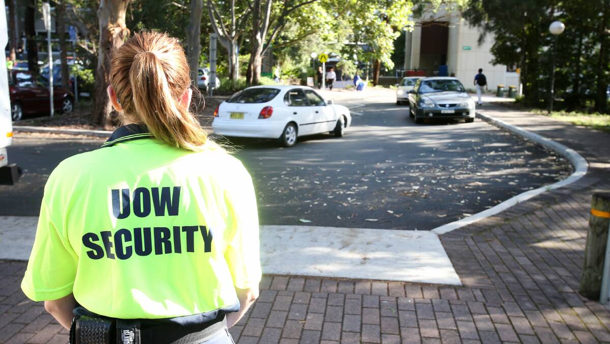 A UOW security officer watches traffic flow on campus. Picture: KIRK GILMOUR