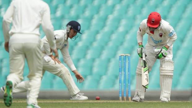 Hughes staggers after being struck. Photo: Getty Images